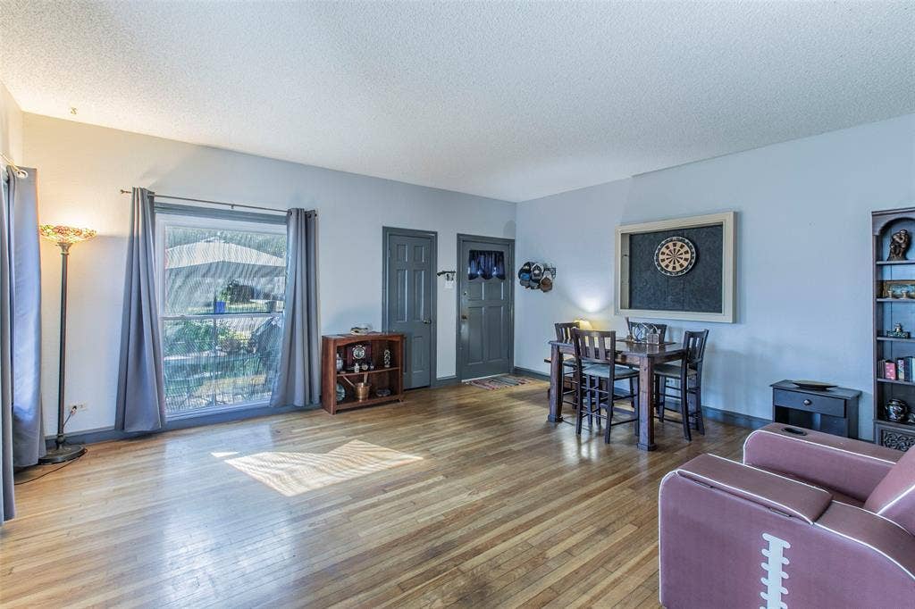 2603 Pine Avenue, Waco, TX 76708 Living area featuring wood-type flooring and a textured ceiling