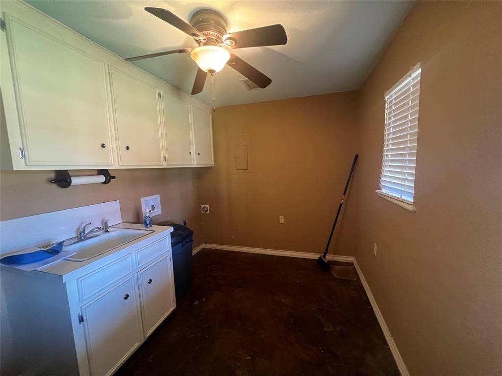 4038 State Highway 351, Abilene, TX 79601 Laundry area with hookup for a washing machine, cabinet space, a ceiling fan, and electric dryer hookup