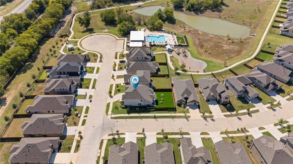 Aerial overview of property's location featuring a large body of water and nearby suburban area