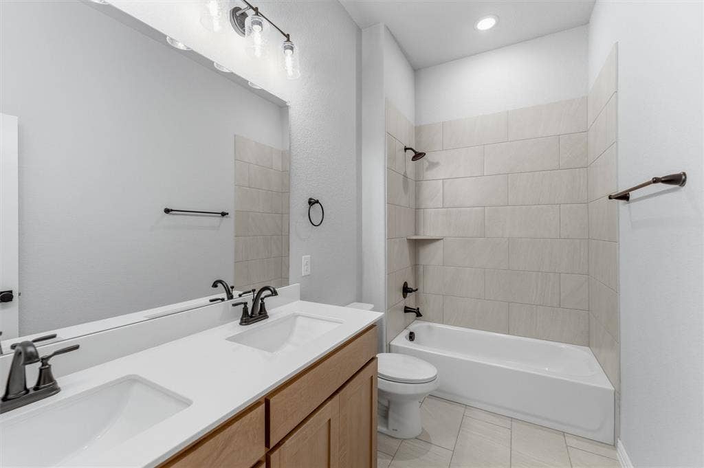 9007 County Road 623, Blue Ridge, TX 75424 Bathroom with double vanity, shower / washtub combination, light tile patterned floors, and recessed lighting