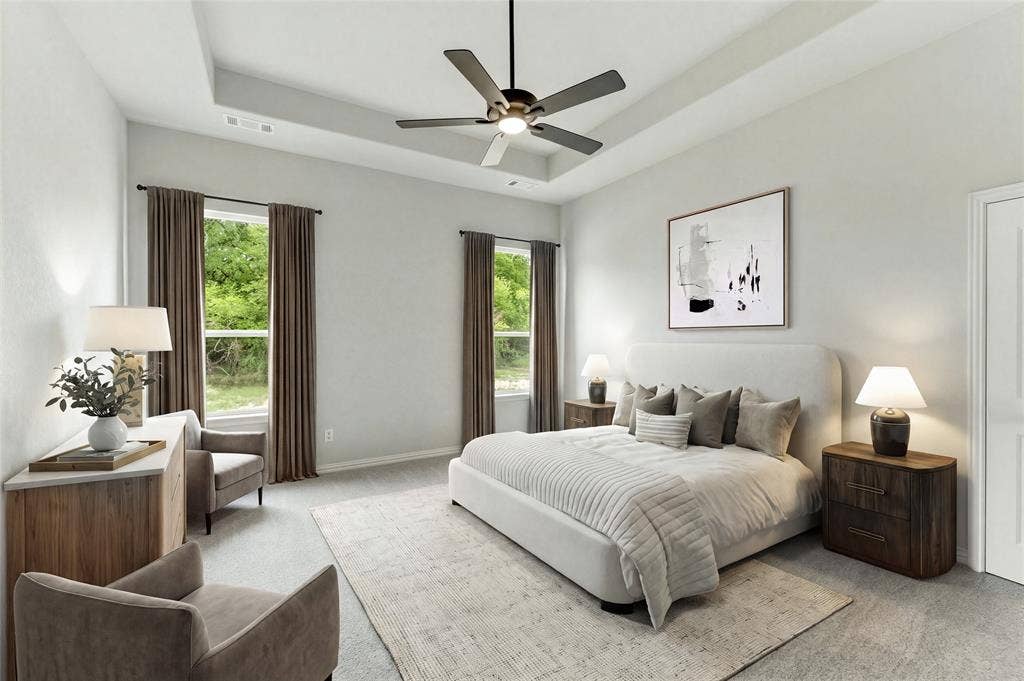 9007 County Road 623, Blue Ridge, TX 75424 Tray ceiling with a ceiling fan, two windows with drapery, and a white paneled door