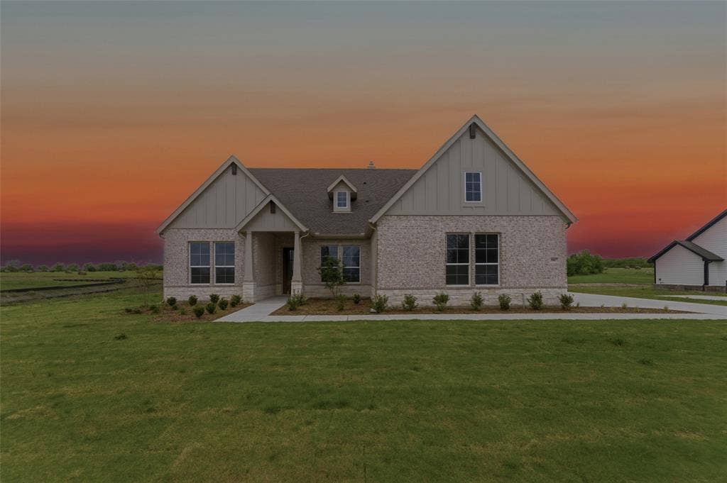 9007 County Road 623, Blue Ridge, TX 75424 Craftsman inspired home with board and batten siding, brick siding, and a lawn