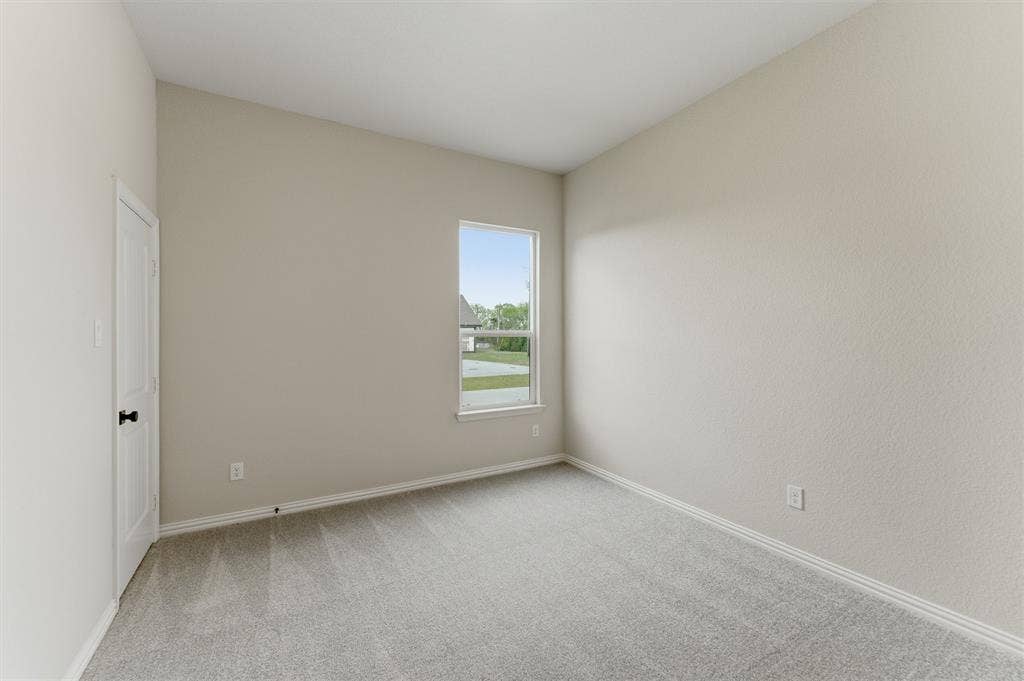 9007 County Road 623, Blue Ridge, TX 75424 Empty room with light carpet and baseboards