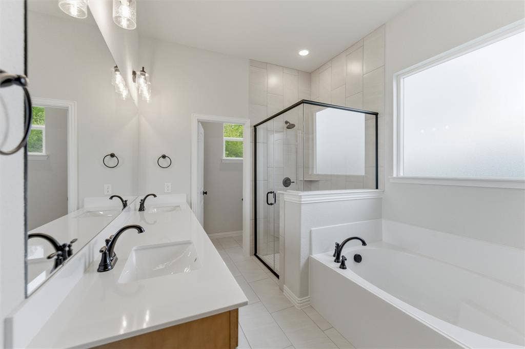 9007 County Road 623, Blue Ridge, TX 75424 Full bath with double vanity, a stall shower, a bath, light tile patterned floors, and recessed lighting