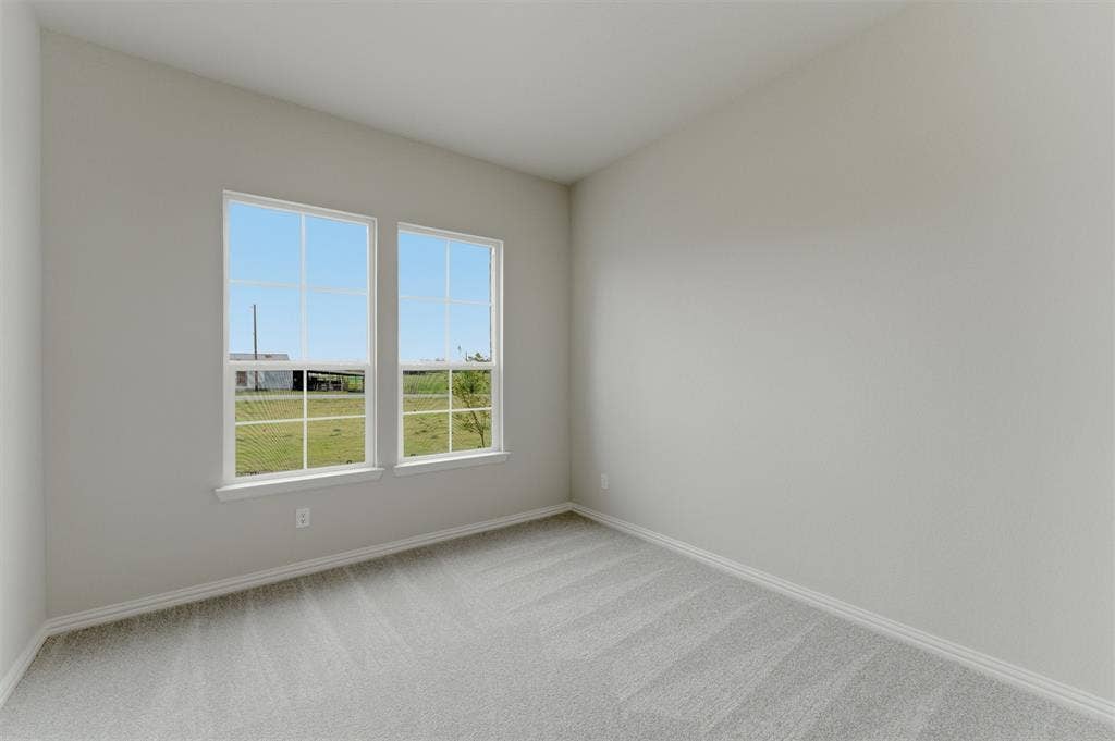 9007 County Road 623, Blue Ridge, TX 75424 Unfurnished room featuring light carpet and baseboards