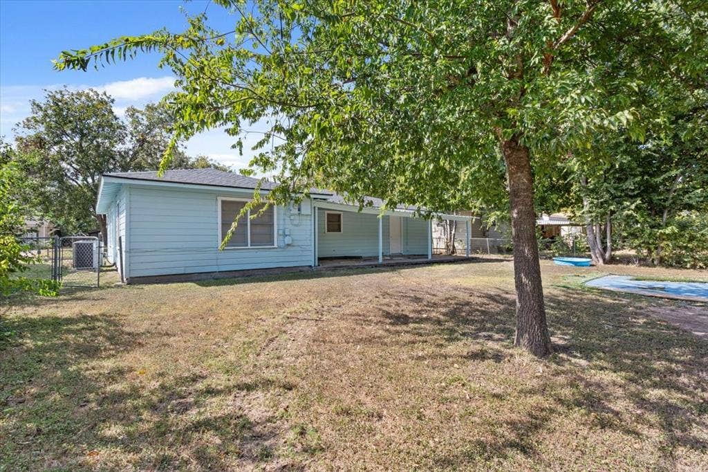 2424 S 26th Street, Waco, TX 76706 Rear view of house featuring a patio area and a pool
