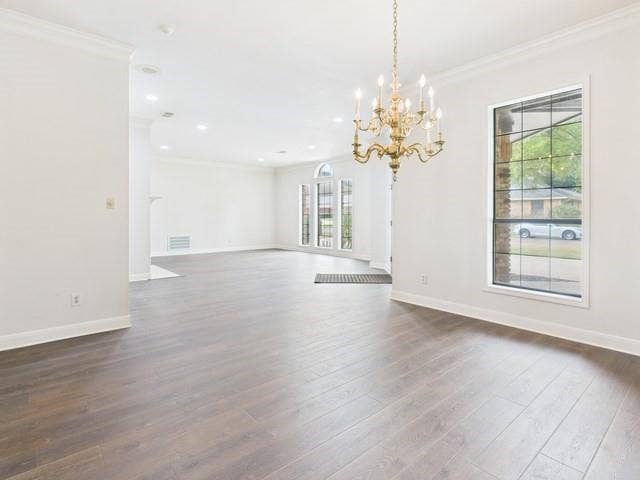 1178 E Oval Drive, Athens, TX 75751 Unfurnished dining area with crown molding, a chandelier, dark wood-style floors, and recessed lighting