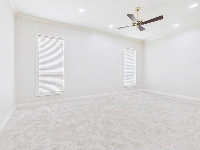 1178 E Oval Drive, Athens, TX 75751 Empty room featuring crown molding, light carpet, a ceiling fan, and recessed lighting