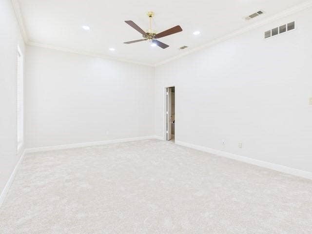 1178 E Oval Drive, Athens, TX 75751 Empty room with crown molding, light colored carpet, a ceiling fan, and recessed lighting