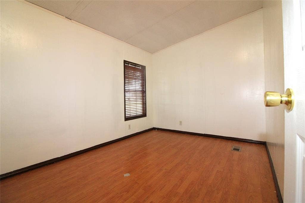 5199 Timarron Drive, Scurry, TX 75158 Bedroom #5 OR OFFICESpare room with wood finished floors and baseboards