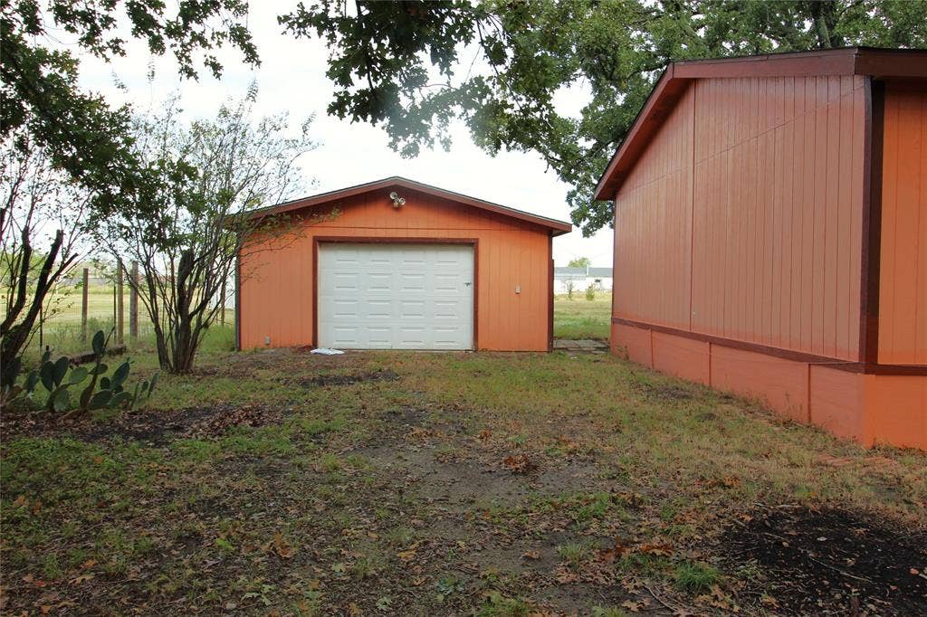 5199 Timarron Drive, Scurry, TX 75158 View of detached garage