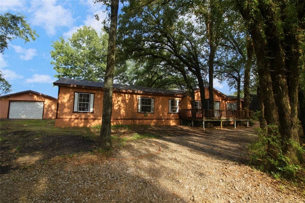 5199 Timarron Drive, Scurry, TX 75158 View of home's exterior with a deck