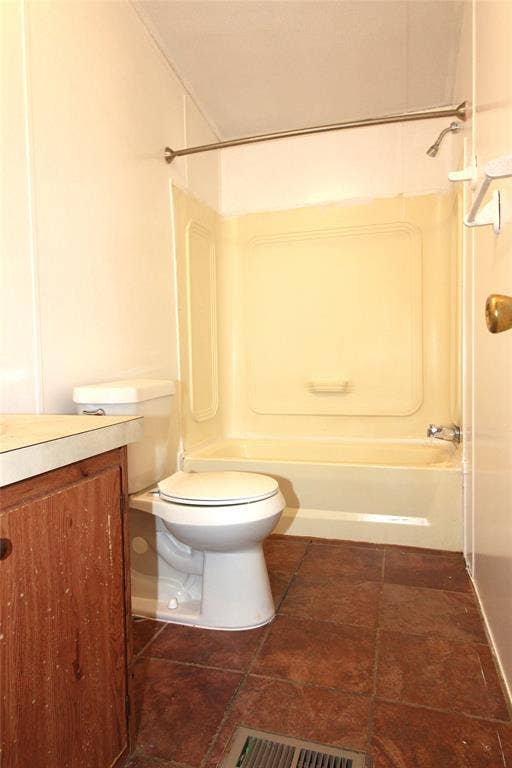 5199 Timarron Drive, Scurry, TX 75158 Bathroom #1Full bath featuring vanity, bathtub / shower combination, and dark tile patterned floors