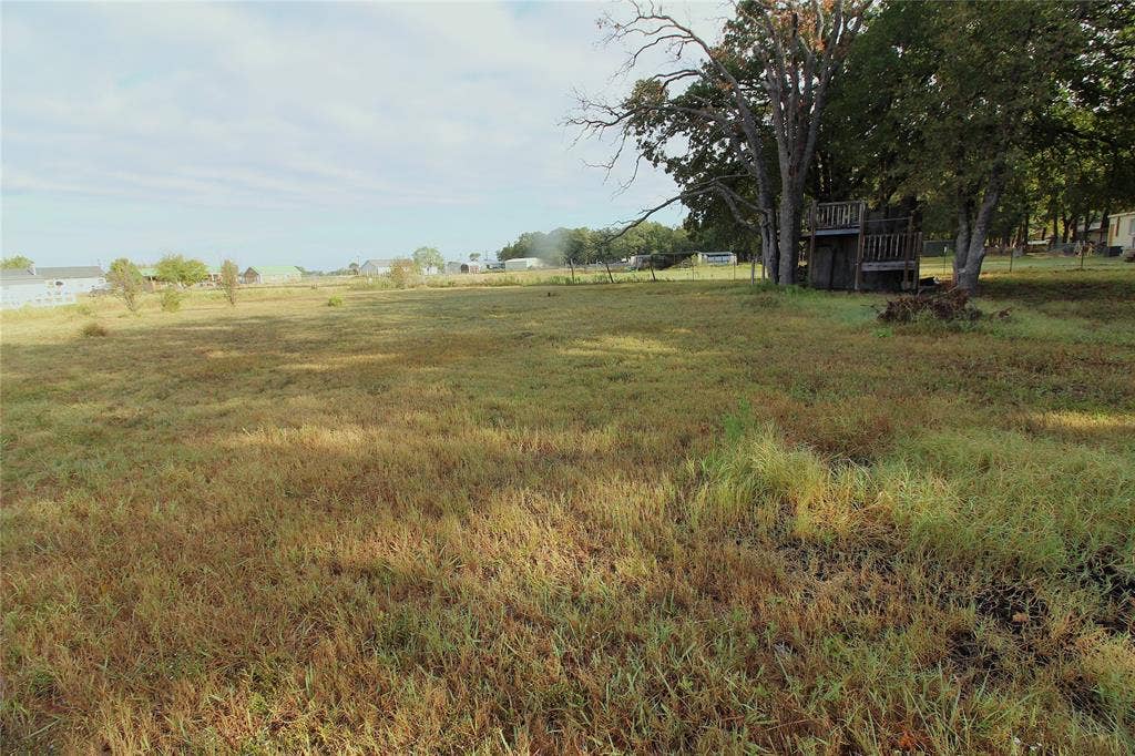 5199 Timarron Drive, Scurry, TX 75158 View of yard with a view of countryside and a wooden deck