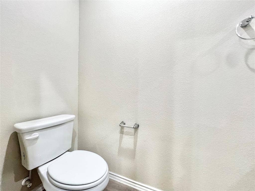 3501 E Renfro Street, #106, Burleson, TX 76028 Half bathroom with toilet