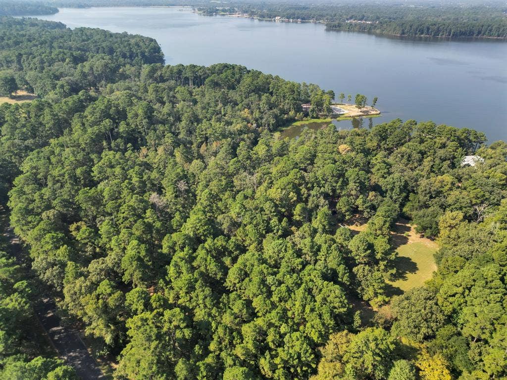 Lot 20-C Eastside Road, Tyler, TX 75707 View of property location featuring a forest and a nearby body of water