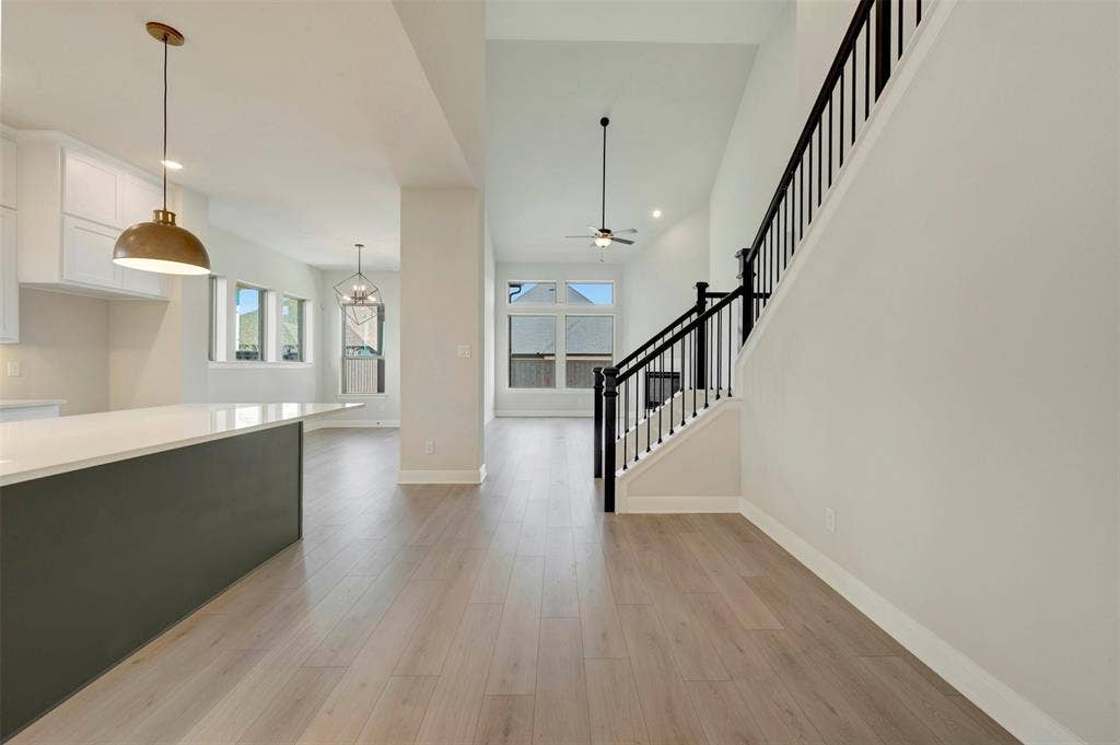 3752 Bermuda Grass Way, Grand Prairie, TX 76084 Foyer featuring light wood finished floors, a chandelier, and a ceiling fan