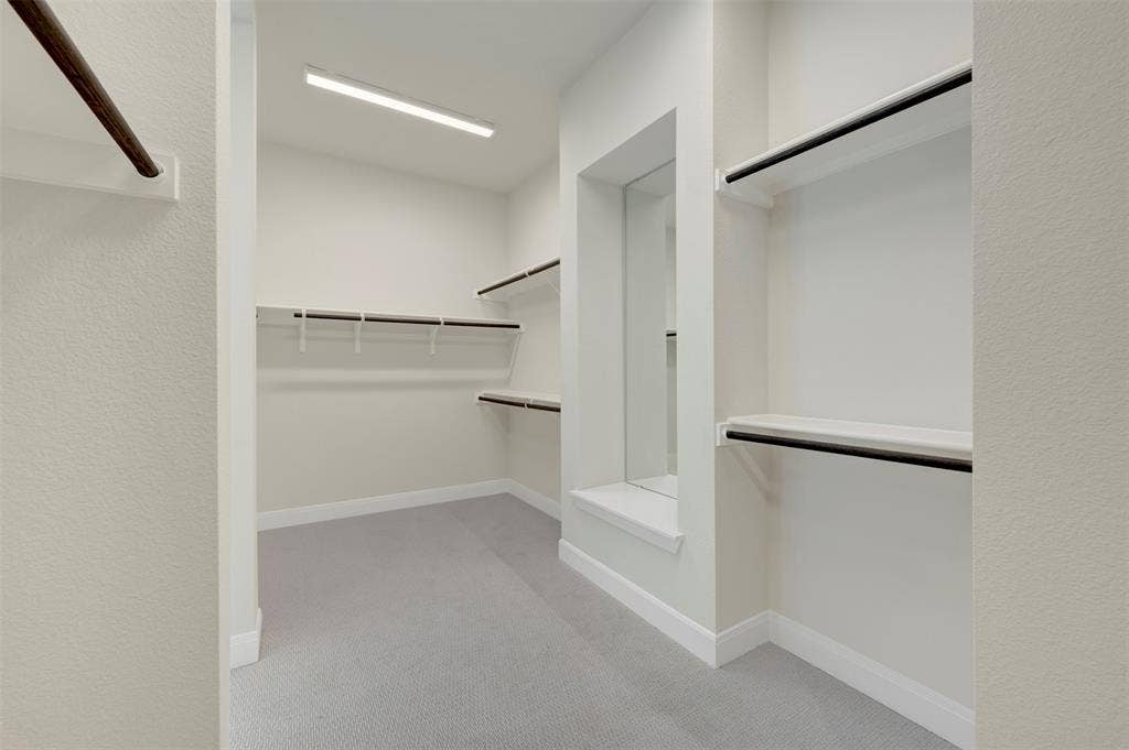 3752 Bermuda Grass Way, Grand Prairie, TX 76084 Walk in closet featuring light colored carpet