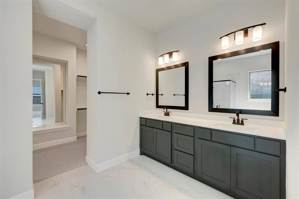 3752 Bermuda Grass Way, Grand Prairie, TX 76084 Full bath featuring healthy amount of natural light, double vanity, light marble finish flooring, and a stall shower