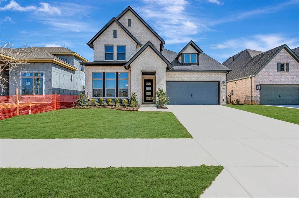 3752 Bermuda Grass Way, Grand Prairie, TX 76084 View of front of property featuring brick siding and concrete driveway