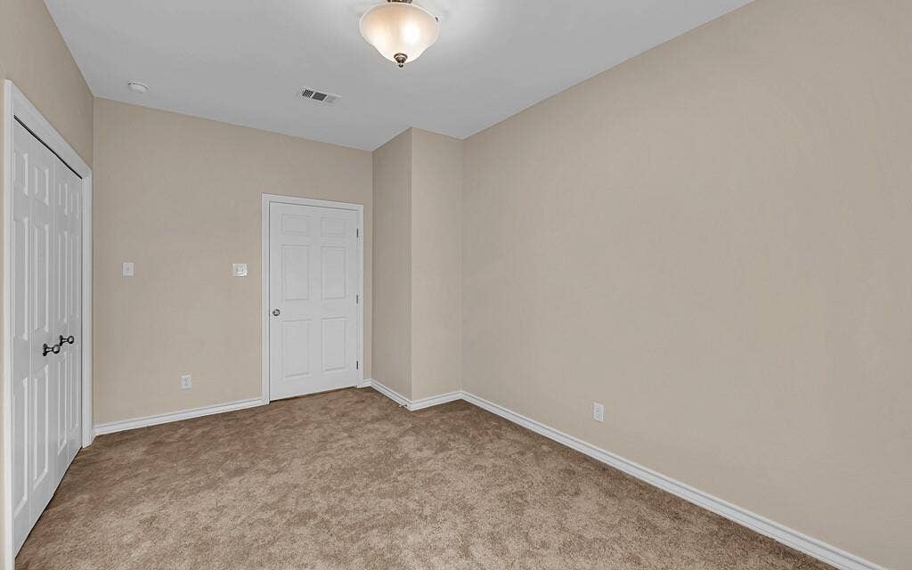 556 Wildwood Trail, Lorena, TX 76655 Unfurnished bedroom with light colored carpet and a closet