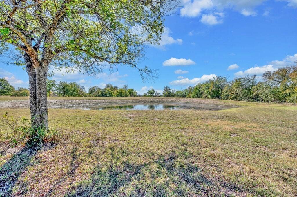 556 Wildwood Trail, Lorena, TX 76655 View of green lawn with a water view