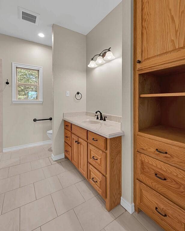 556 Wildwood Trail, Lorena, TX 76655 Bathroom with light tile patterned floors, vanity, and recessed lighting