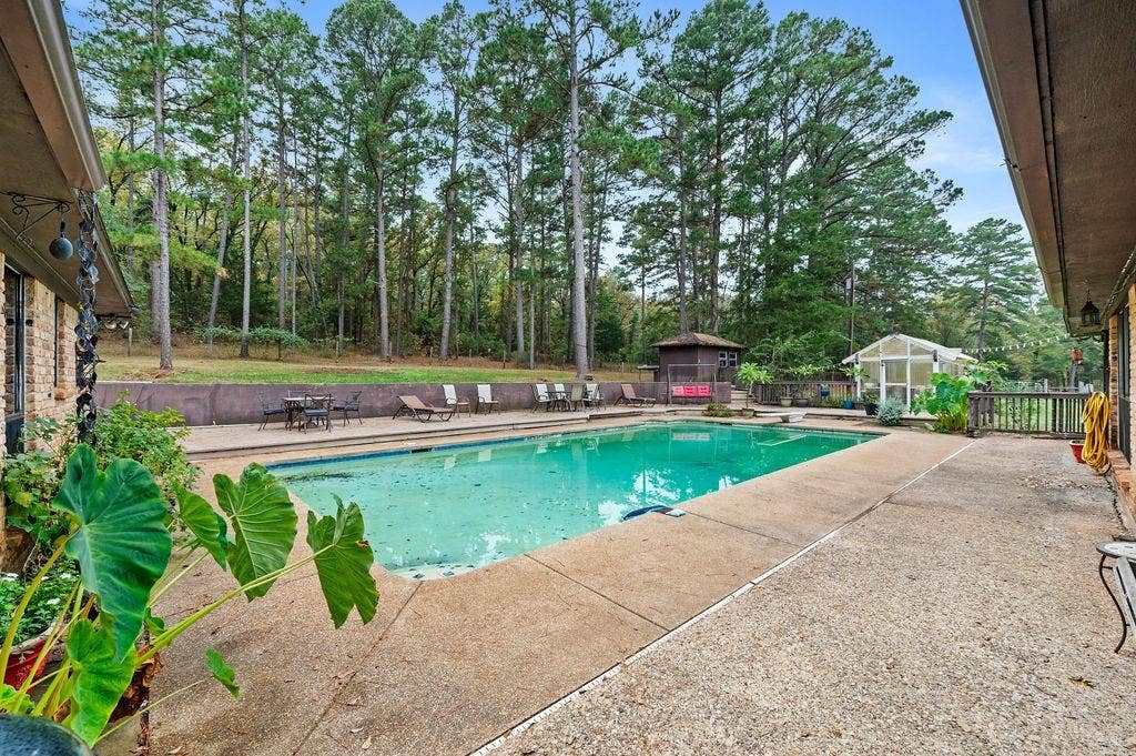 19418 CR 4125, Lindale, TX 75771 View of pool with a patio area, an outdoor structure, and a fenced backyard