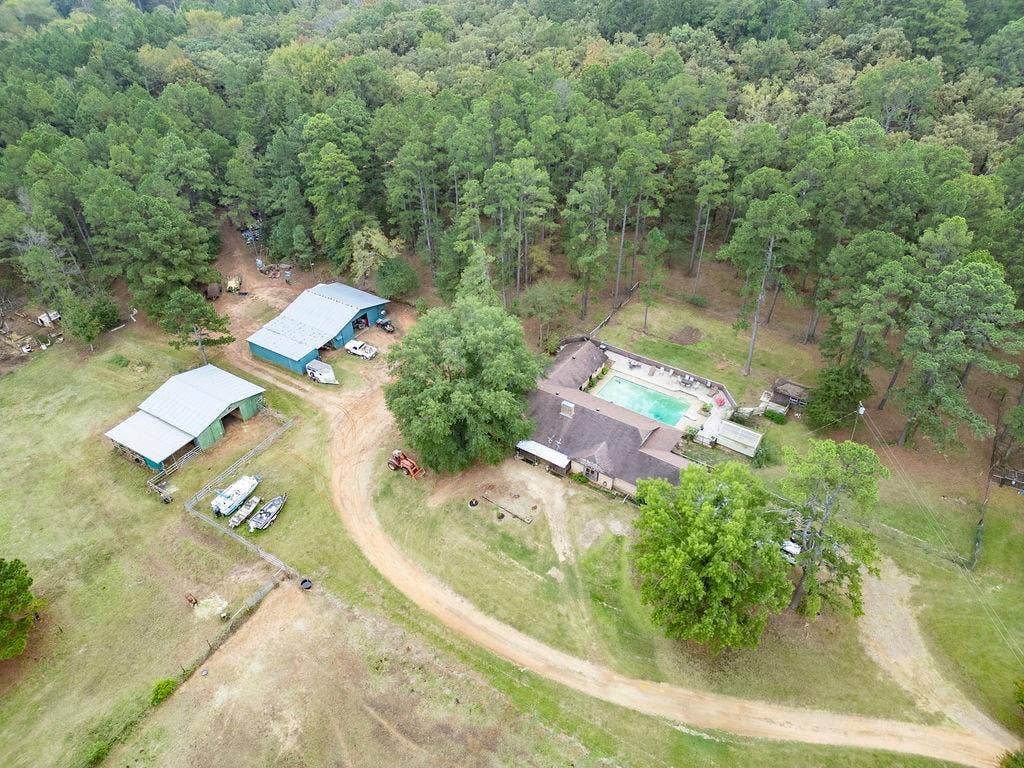 19418 CR 4125, Lindale, TX 75771 Aerial overview of property's location with a heavily wooded area