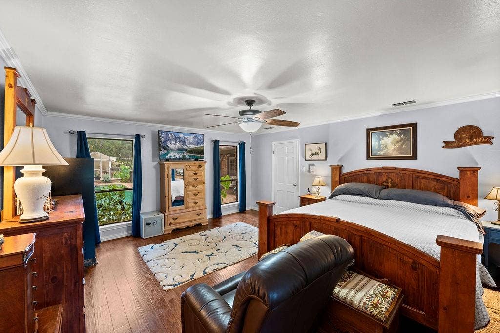 19418 CR 4125, Lindale, TX 75771 Bedroom with wood finished floors, crown molding, and a ceiling fan