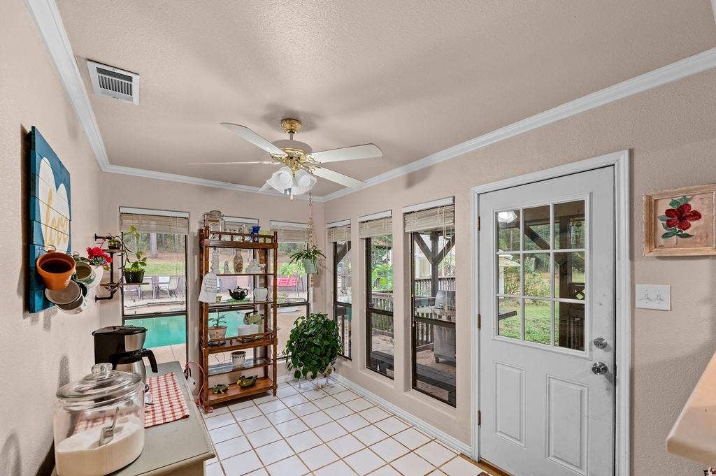 19418 CR 4125, Lindale, TX 75771 Entryway featuring ornamental molding, tile patterned floors, plenty of natural light, and ceiling fan
