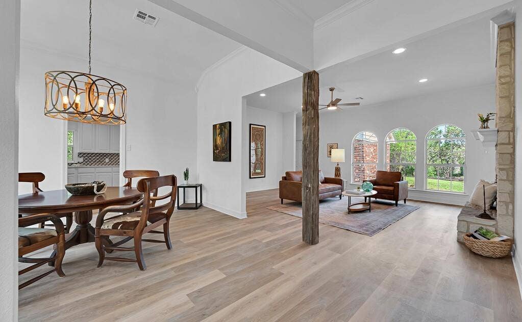 1068 Brazos Bluff Drive, China Spring, TX 76633 Dining area with light wood finished floors, recessed lighting, ornamental molding, a chandelier, and ceiling fan