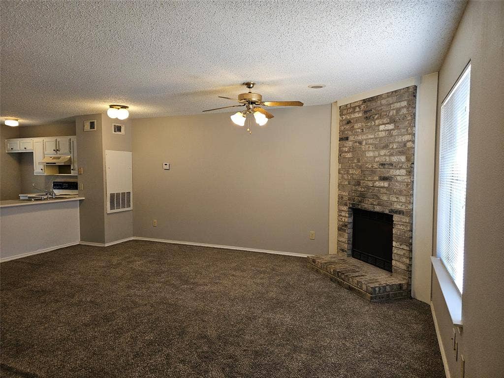 808-810 Red Bud Drive, DeSoto, TX 75115 810 - Living and hearth as viewed from front entry (for rentals, fireplace is covered; simple to remove covering.)