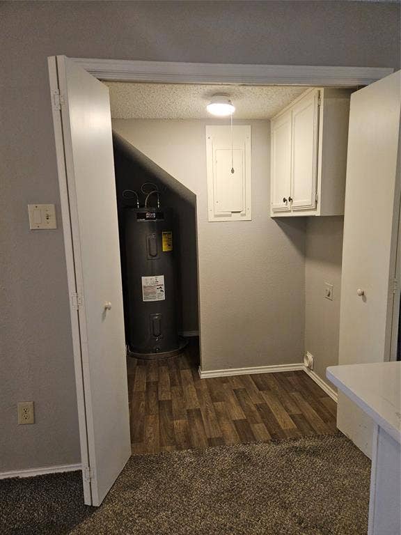 808-810 Red Bud Drive, DeSoto, TX 75115 810 - Doors open to show area for full-sized washer and dryer, with electric waterheater behind.