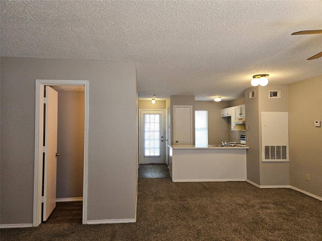 808-810 Red Bud Drive, DeSoto, TX 75115 810 Downstairs half-bath across from entry, view of dining area, back door, and kitchen countertop bar.
