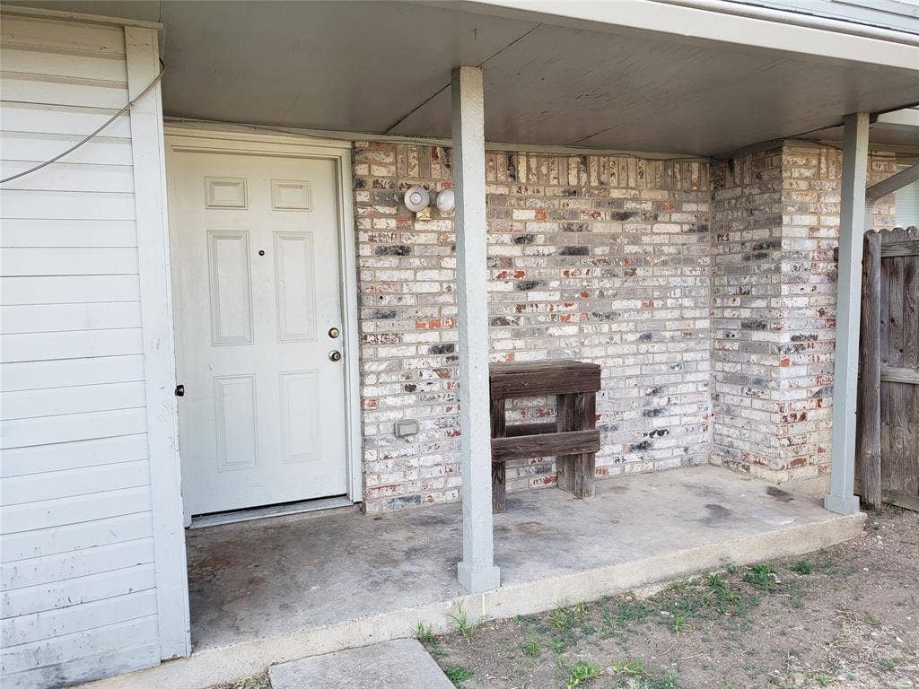 808-810 Red Bud Drive, DeSoto, TX 75115 808 - Back covered porch, storage closet to the left.