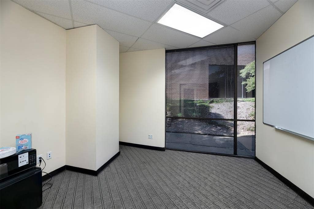 1610 Corporate Court, Irving, TX 75038 Carpeted spare room featuring baseboards and a paneled ceiling