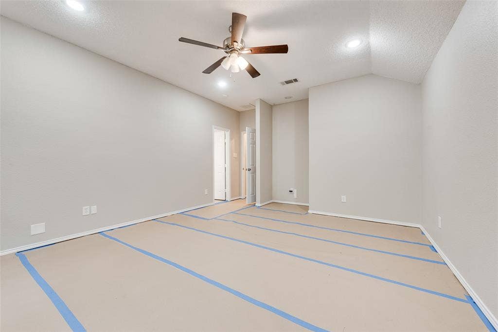 617 Madeline Court, Azle, TX 76020 Spare room with lofted ceiling, recessed lighting, and ceiling fan