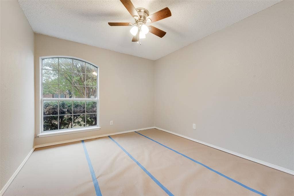 617 Madeline Court, Azle, TX 76020 Spare room with ceiling fan and a textured ceiling