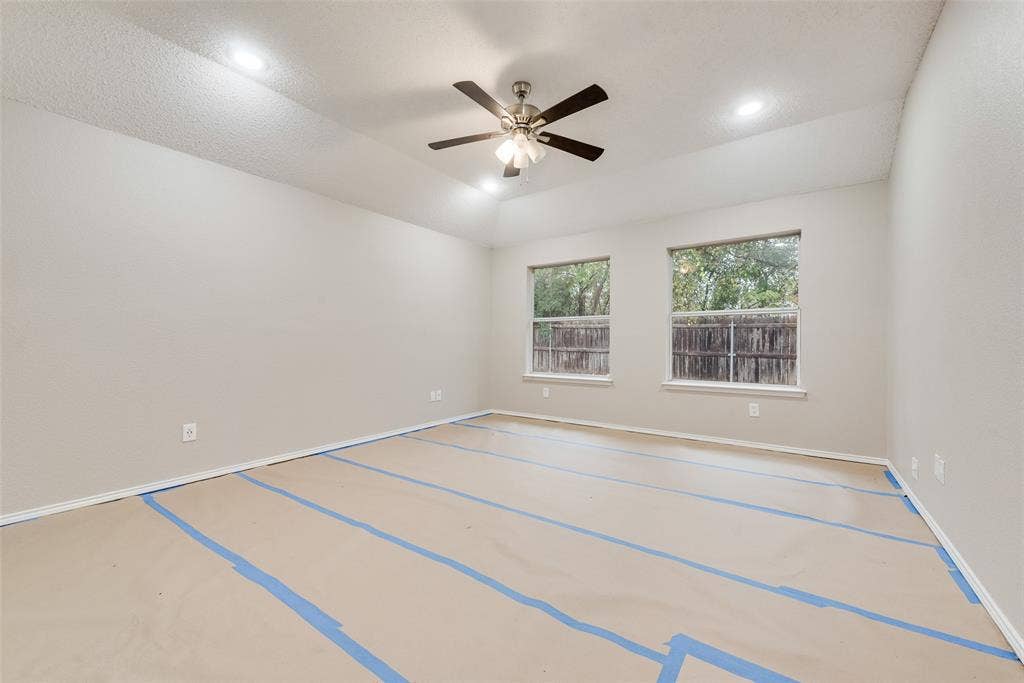 617 Madeline Court, Azle, TX 76020 Unfurnished room featuring a ceiling fan and recessed lighting