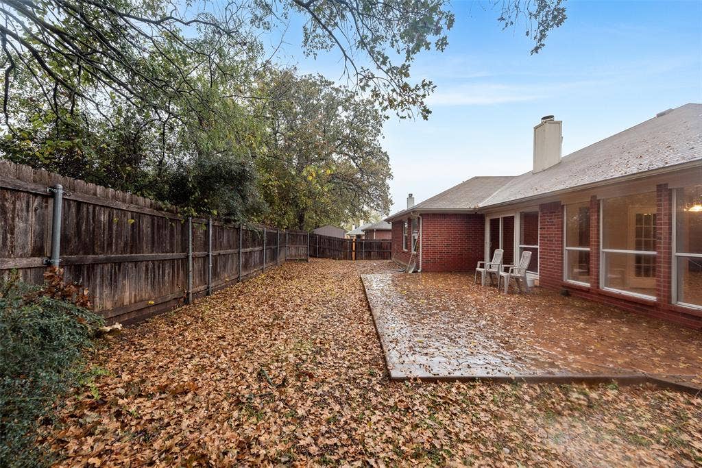 617 Madeline Court, Azle, TX 76020 Fenced backyard with a patio area
