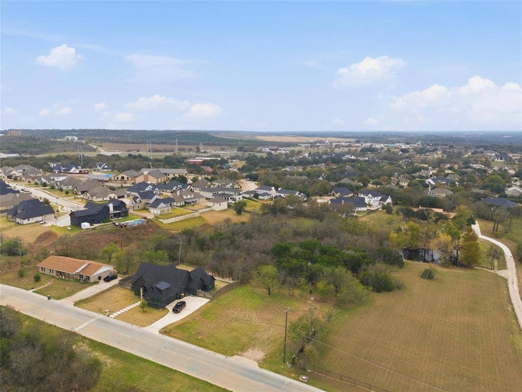 13854 Harbor Drive, Woodway, TX 76712 Aerial view of property and surrounding area with nearby suburban area
