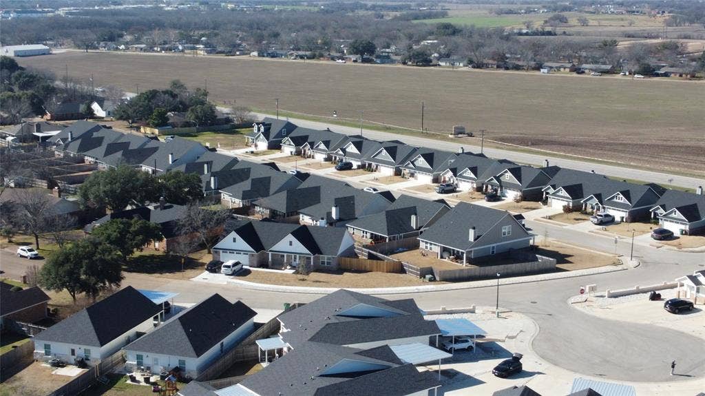 518 Alamo Court, McGregor, TX 76657 Aerial perspective of suburban area