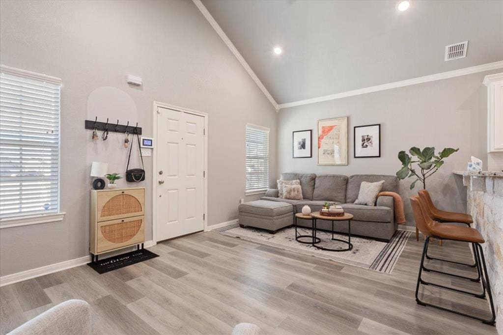 518 Alamo Court, McGregor, TX 76657 Living room with high vaulted ceiling and light wood-type flooring