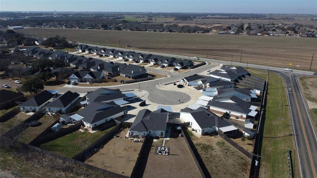 518 Alamo Court, McGregor, TX 76657 Aerial overview of property's location featuring nearby suburban area