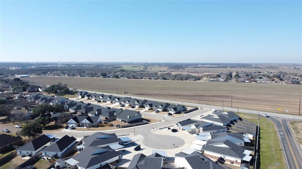 518 Alamo Court, McGregor, TX 76657 Aerial perspective of suburban area