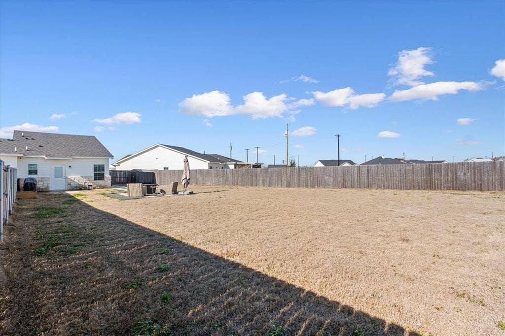 518 Alamo Court, McGregor, TX 76657 View of fenced backyard