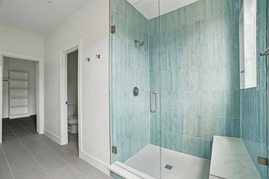 2524 Havenhurst Street, #102, Farmers Branch, TX 75234 Full bath featuring a stall shower and light tile patterned flooring