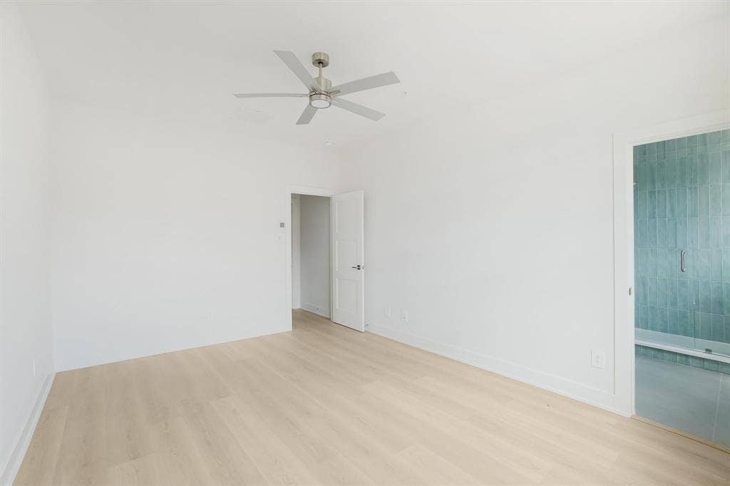 2524 Havenhurst Street, #102, Farmers Branch, TX 75234 Unfurnished room featuring light wood-style floors and a ceiling fan