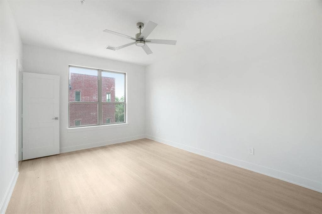 2524 Havenhurst Street, #102, Farmers Branch, TX 75234 Empty room featuring light wood-type flooring and ceiling fan